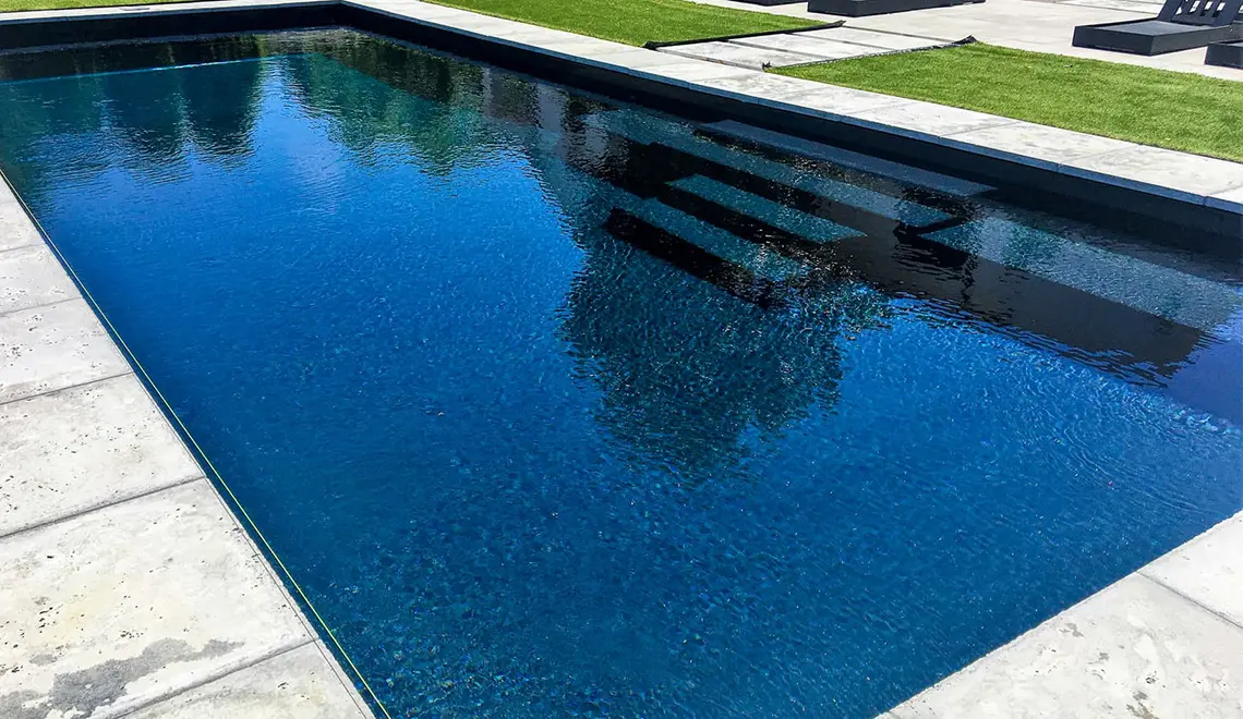 The Grand rectangular fiberglass pool with great side entry steps from Leisure Pools Boston North